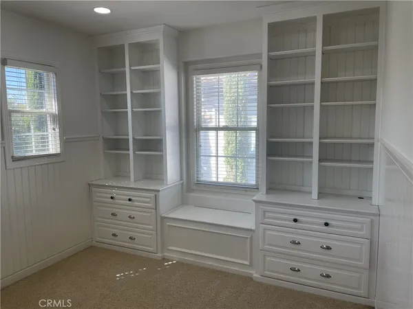 an empty room with wooden floor