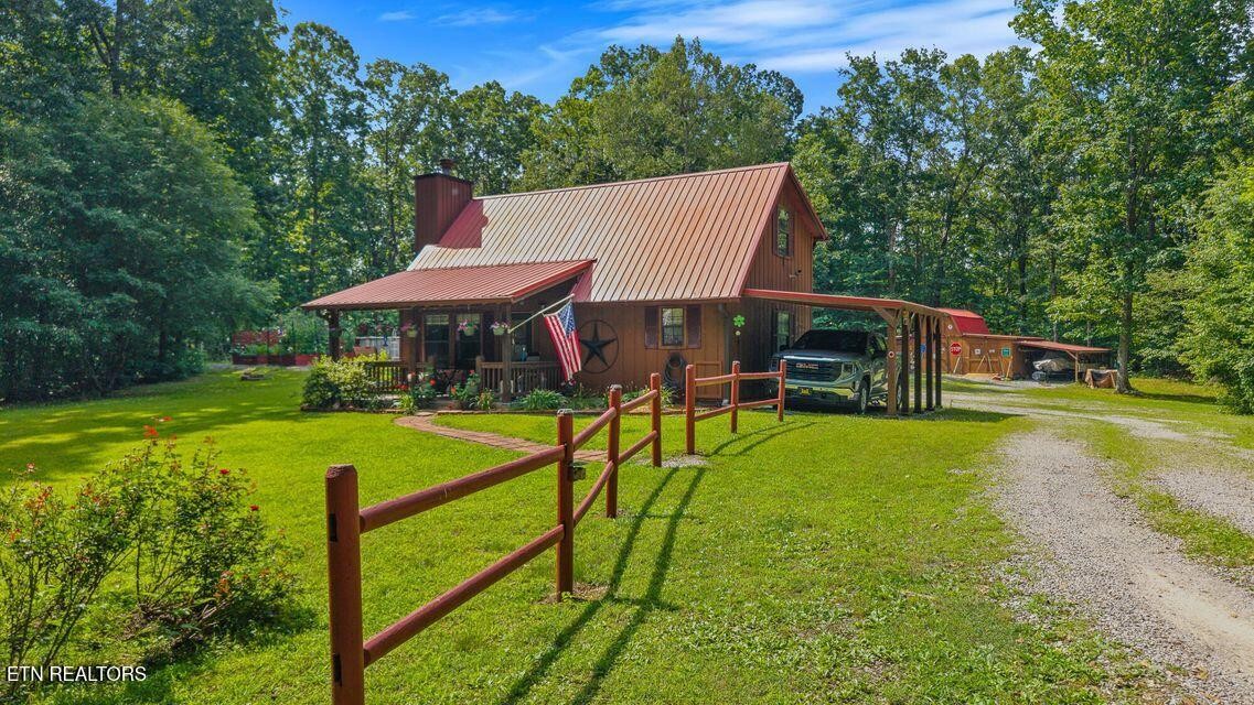 63 County Road 100 Decatur, TN 37322 - Photo 2 of 46 a view of a house with pool and a yard
