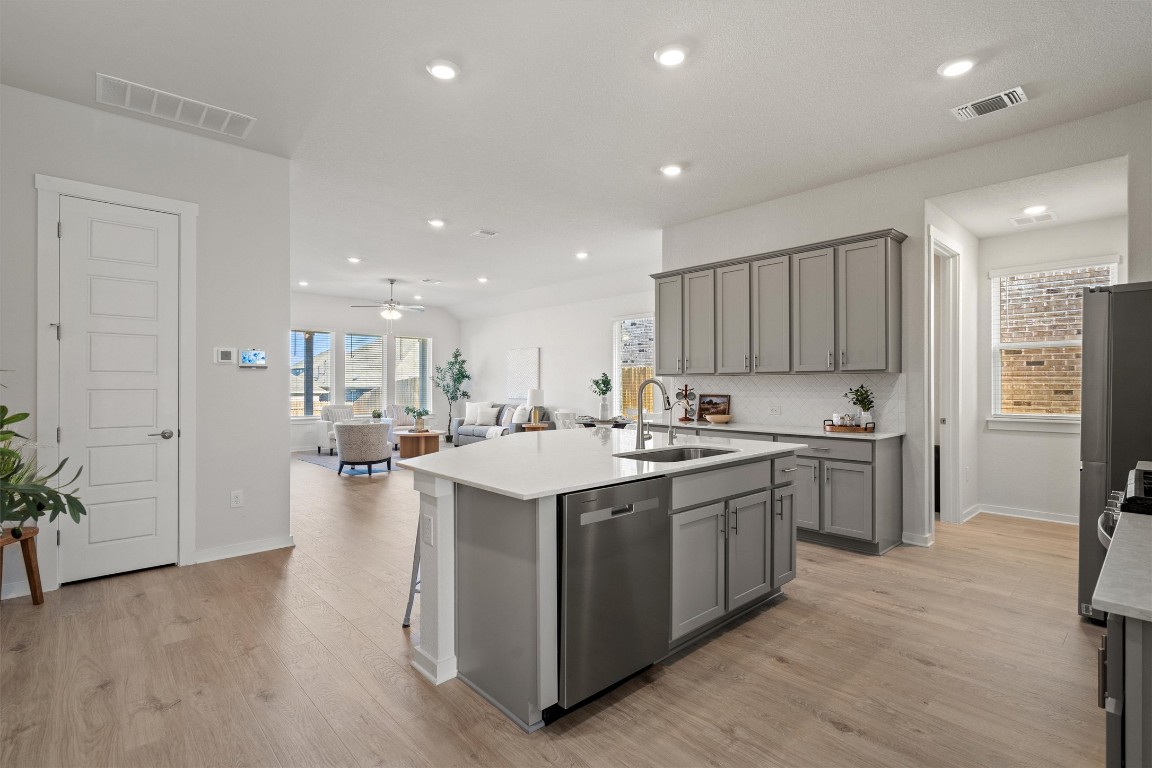 416 Deerpath Street Leander, TX 78641 - Photo 4 of 32 Wood plank flooring, large kitchen island
