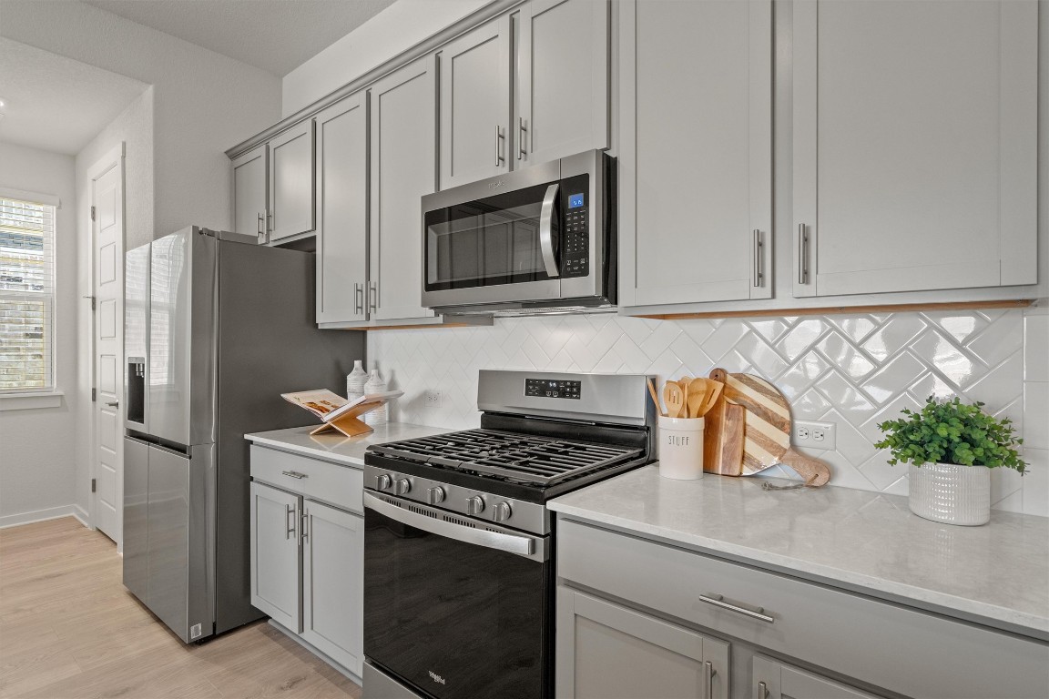 416 Deerpath Street Leander, TX 78641 - Photo 6 of 32 Stainless steel appliances, gas range