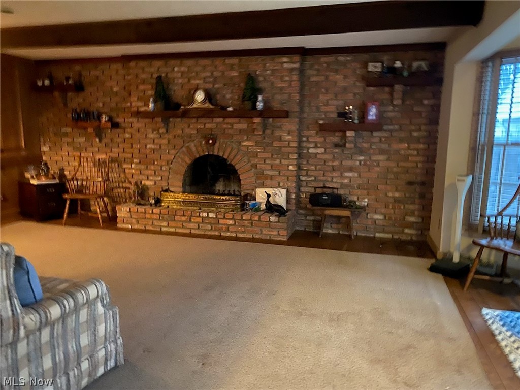 30300 Oakdale Road Willowick, OH 44095 - Photo 4 of 10 Beamed ceiling family room right off the kitchen with bay windows looking out to rear yard.
