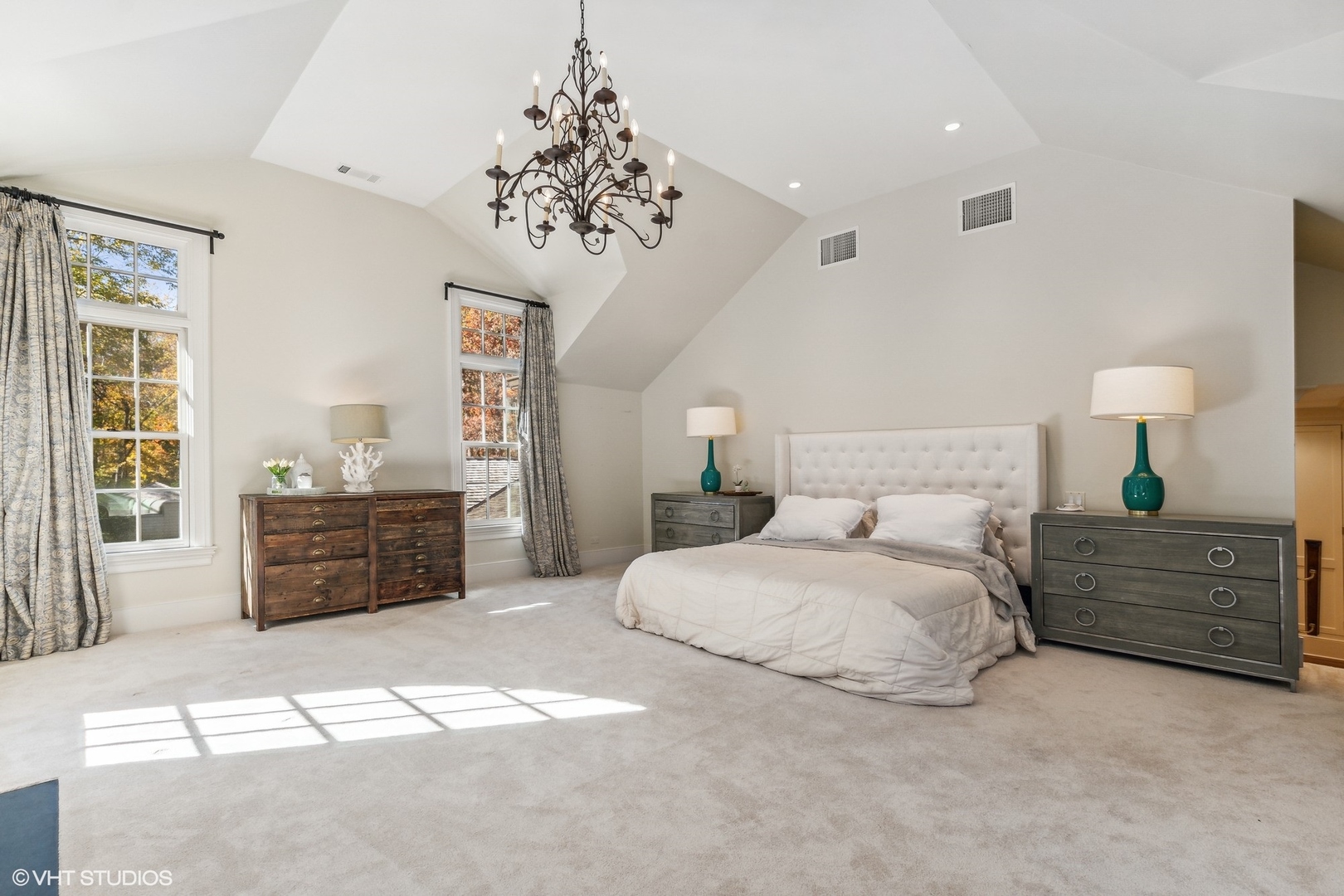 511 Cambridge Lane Lake Bluff, IL 60044 - Photo 31 of 58 a spacious bedroom with a bed and a chandelier