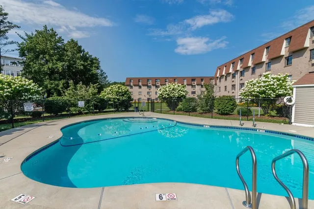 a view of swimming pool from a balcony