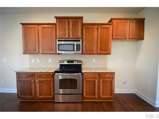 117 Weathers Street Rolesville, NC 27571 - Photo 4 of 16 Beautiful granite counter tops with tile backsplash. Smooth top electric range. Kitchen