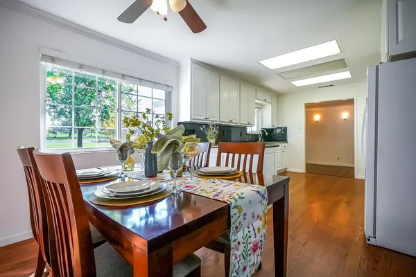 a living room with furniture a window and a flat screen tv