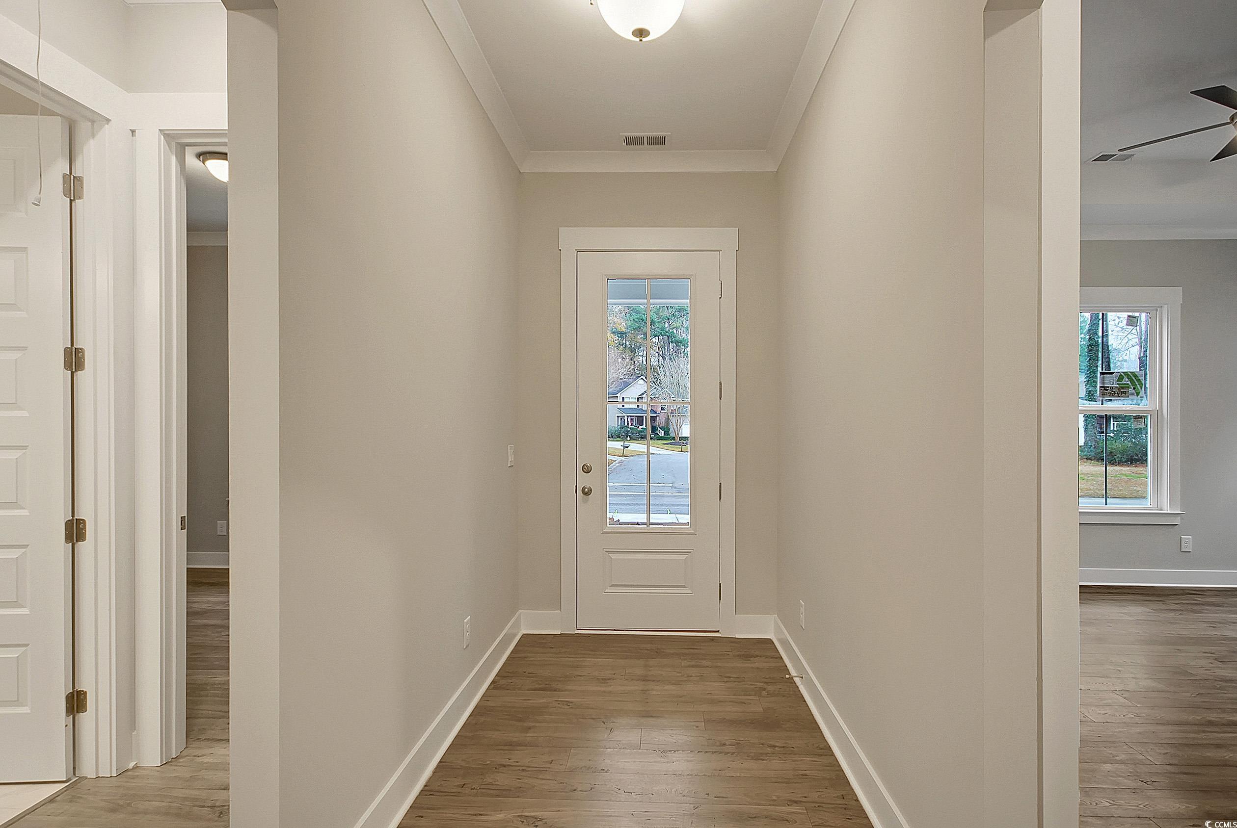 171 Pinebury Drive Georgetown, SC 29440 - Photo 15 of 30 Doorway featuring wood finished floors and crown molding
