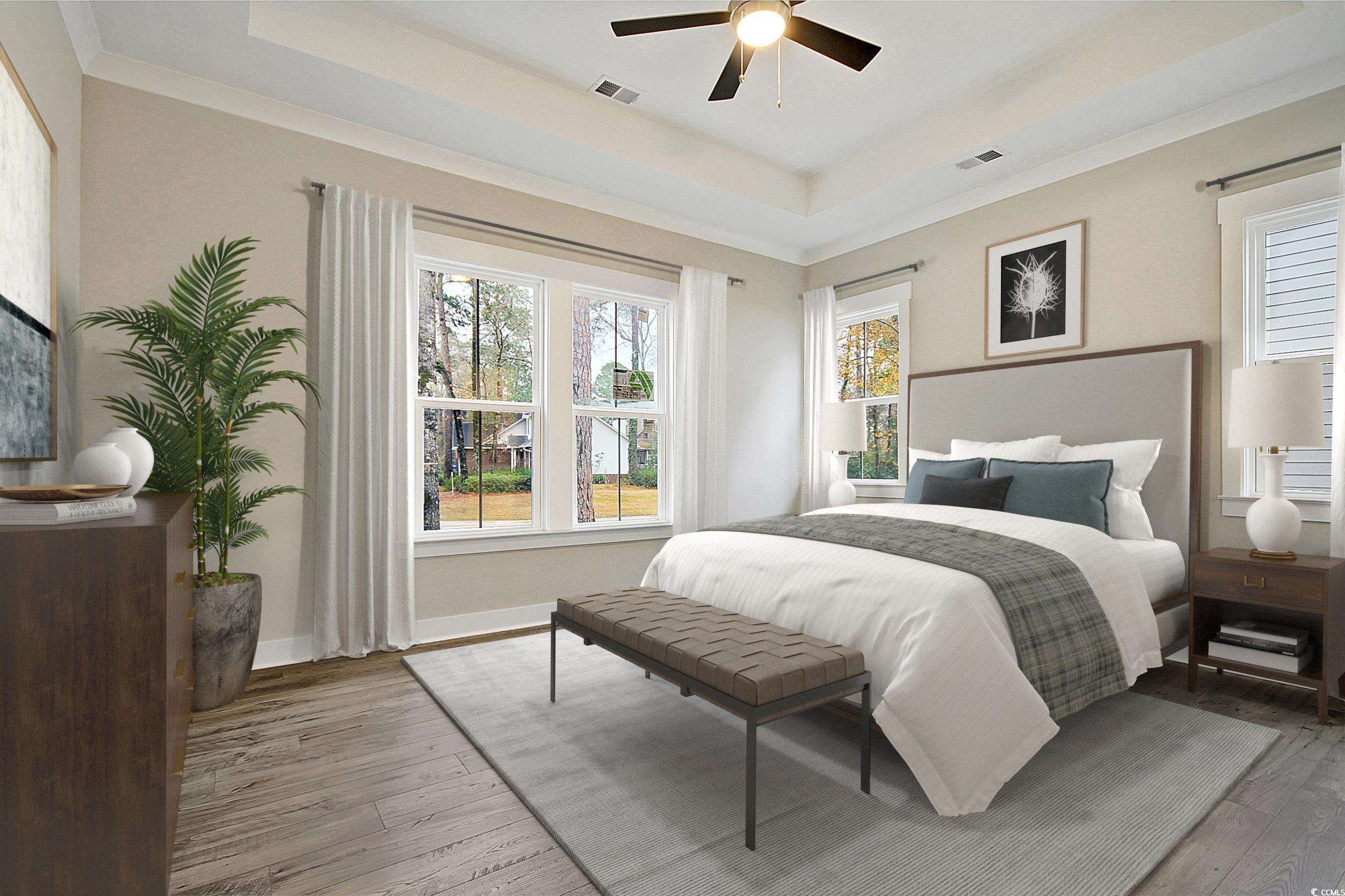 171 Pinebury Drive Georgetown, SC 29440 - Photo 9 of 30 Bedroom with a tray ceiling, multiple windows, and ornamental molding