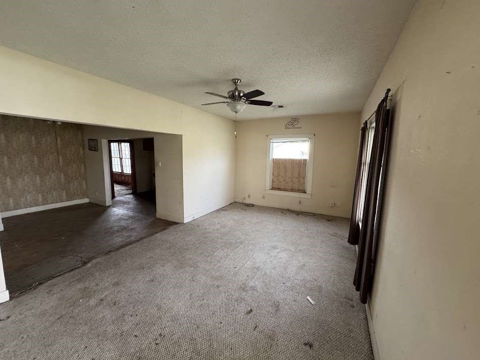 1302 South 23rd Street Temple, TX 76504 - Photo 11 of 11 an empty room with windows and ceiling fan