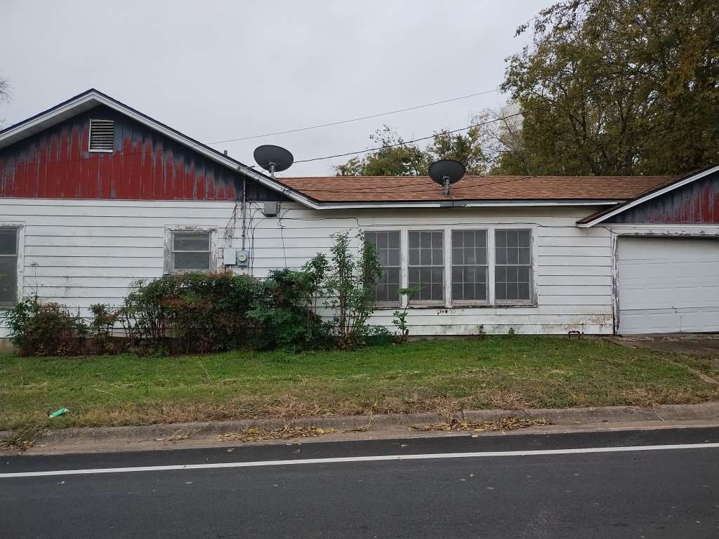 1302 South 23rd Street Temple, TX 76504 - Photo 2 of 11 a front view of a house with a garden and yard