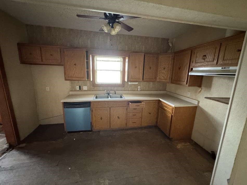 1302 South 23rd Street Temple, TX 76504 - Photo 5 of 11 a kitchen with a sink a stove a refrigerator and cabinets