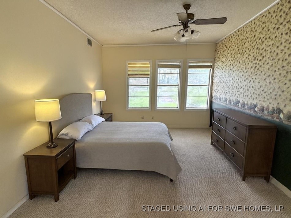 1302 South 23rd Street Temple, TX 76504 - Photo 10 of 13 a bedroom with a bed and a lamp