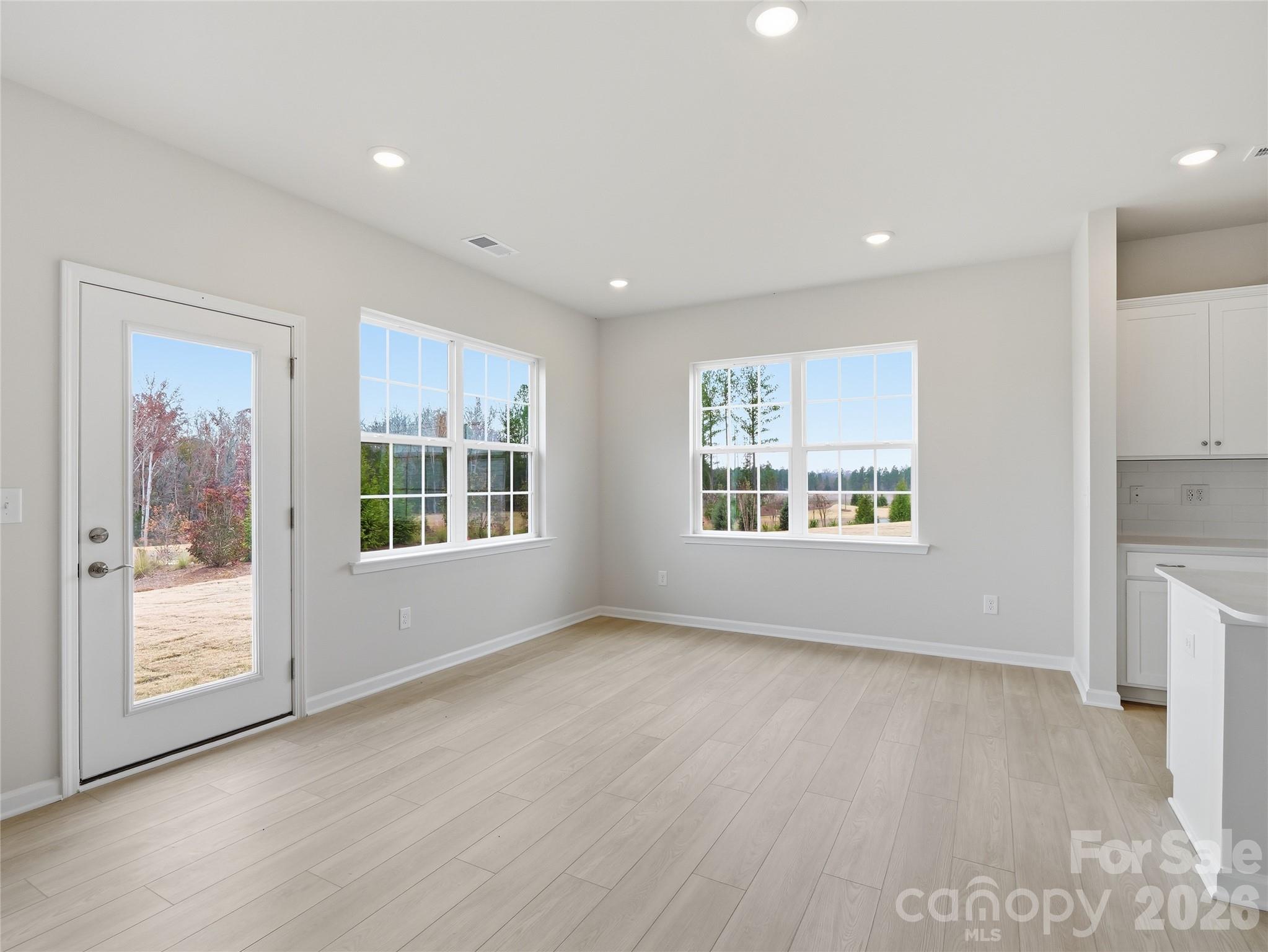 5420 Redbud Road Lancaster, SC 29720 - Photo 18 of 32 a view of an empty room with a window and wooden floor