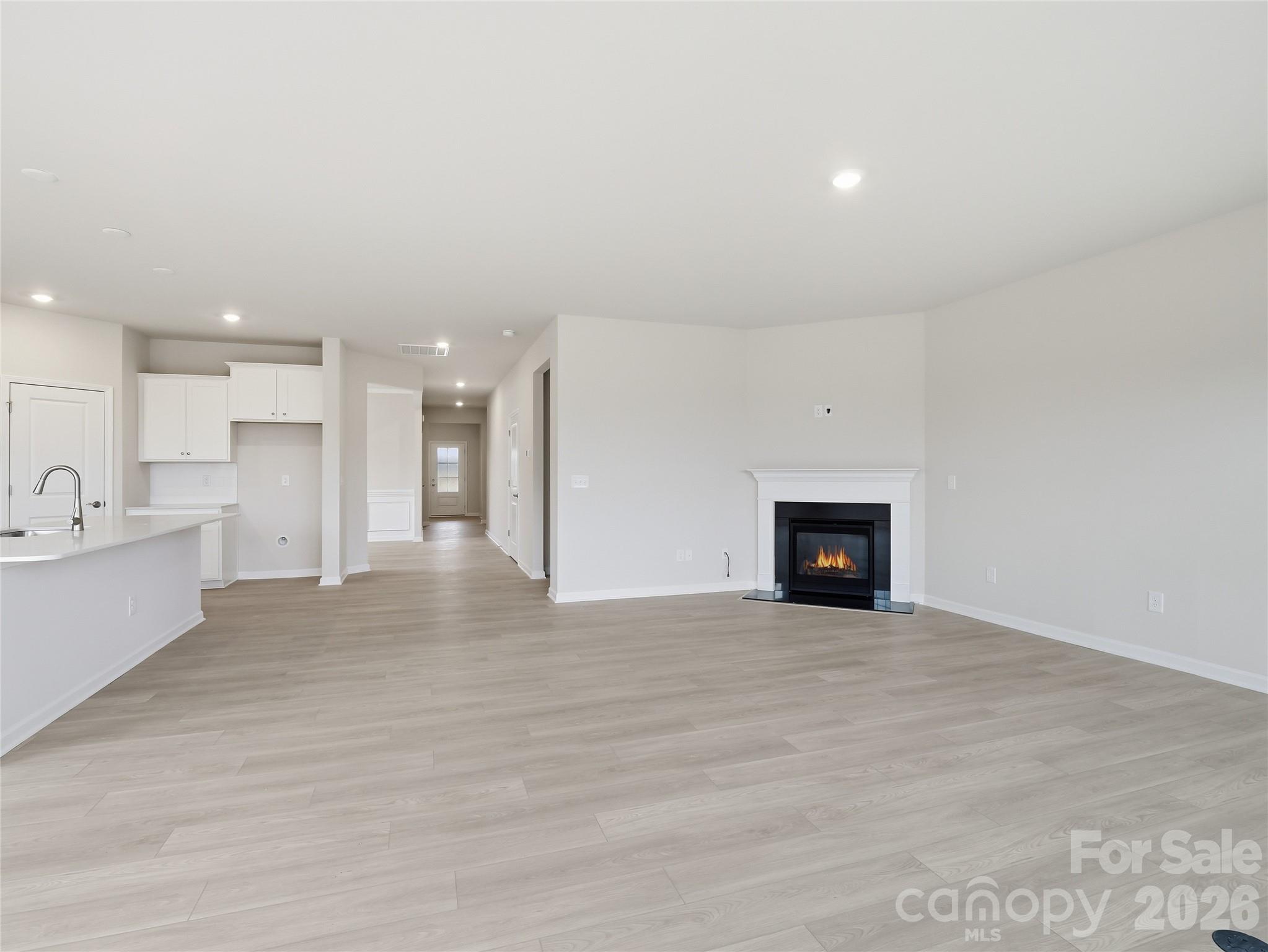 5420 Redbud Road Lancaster, SC 29720 - Photo 6 of 32 a view of an empty room with a fireplace