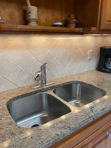 a view closed with a granite countertop sink