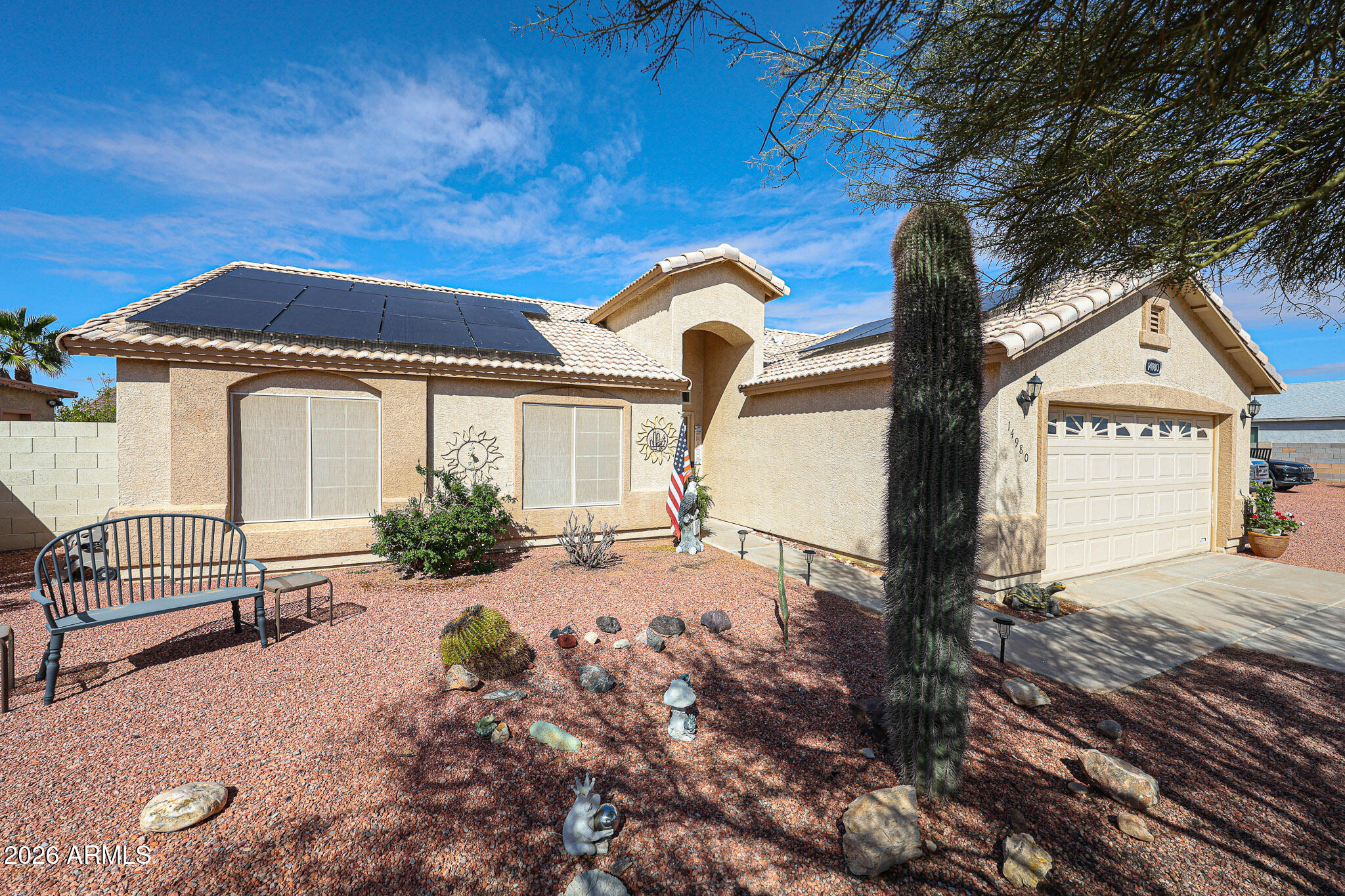 14980 South Capistrano Road Arizona City, AZ 85123 - Photo 2 of 39 a front view of a house with garden