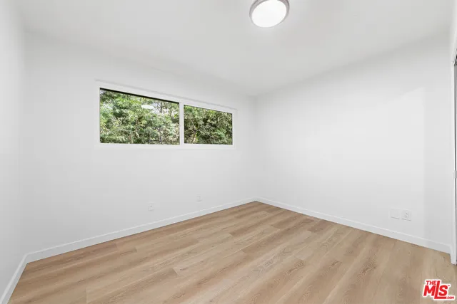 a view of a room that has a window in it
