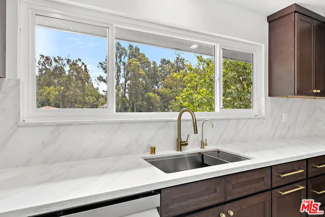 a view of a sink and a mirror