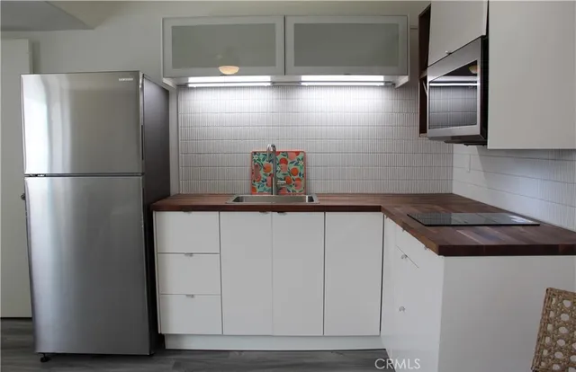 a kitchen with appliances and cabinets