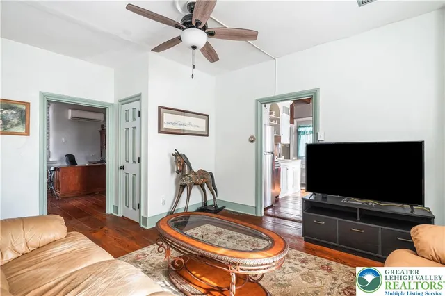 a dining room with furniture and window
