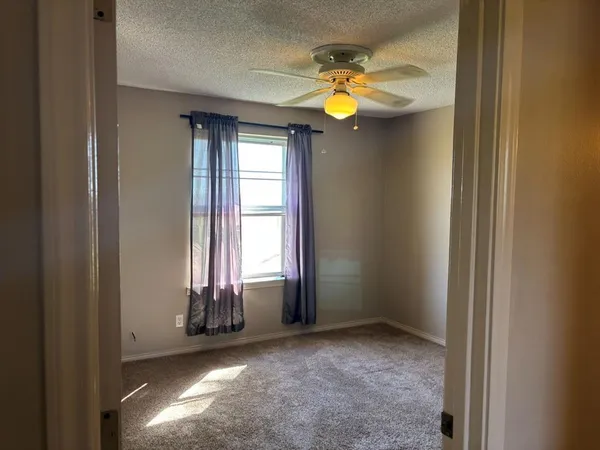 a view of a room that has a window
