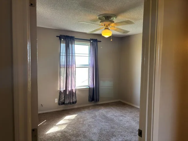 a view of a room that has a window