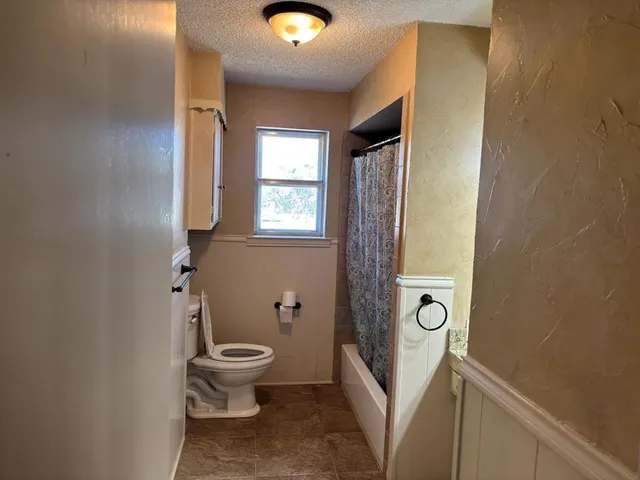 a bathroom with a sink and toilet