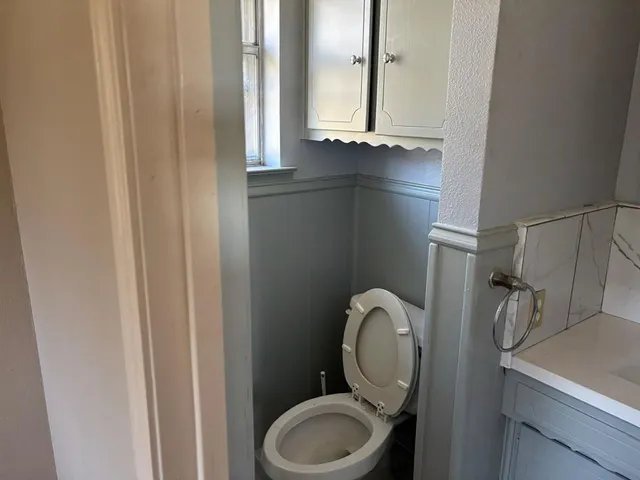 a bathroom with a toilet and a sink