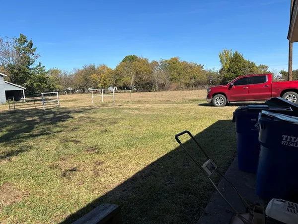 a view of a yard with an outdoor space