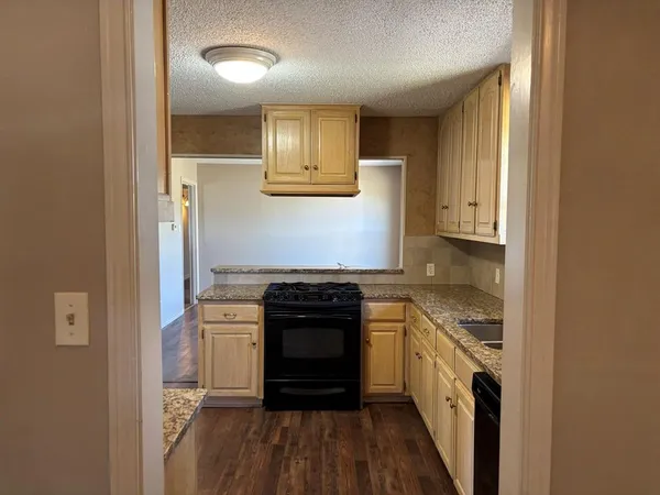 a kitchen with a stove and a refrigerator