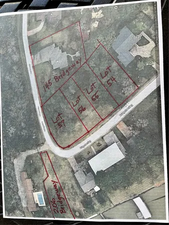 a view of a park with iron fence