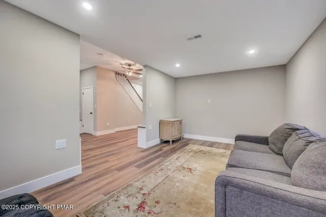 a bedroom with a bed and a couch