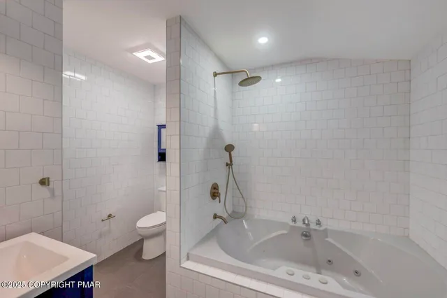 a bedroom with a bed and a table