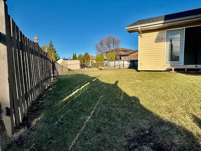 a bathroom with a sink and a yard