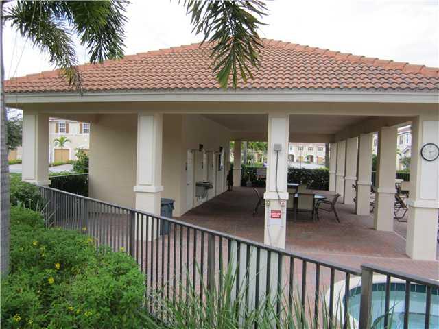 255 Southwest Walking Path Stuart, FL 34997 - Photo 16 of 16 a view of a porch with potted plants