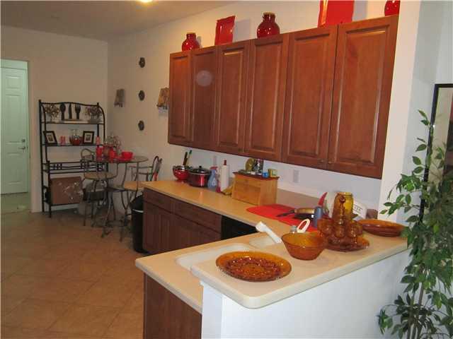 255 Southwest Walking Path Stuart, FL 34997 - Photo 4 of 16 a kitchen with a sink and cabinets