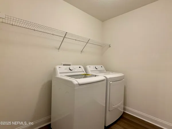 a utility room with dryer and washer