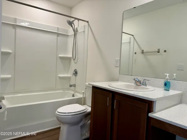 a bathroom with a sink a toilet and a bathtub