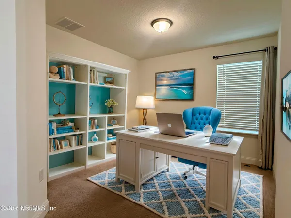 a workspace with furniture and window