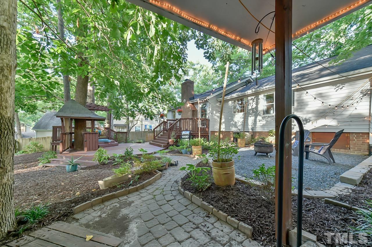 7204 Ray Road Raleigh, NC 27613 - Photo 14 of 40 a front view of a house with garden