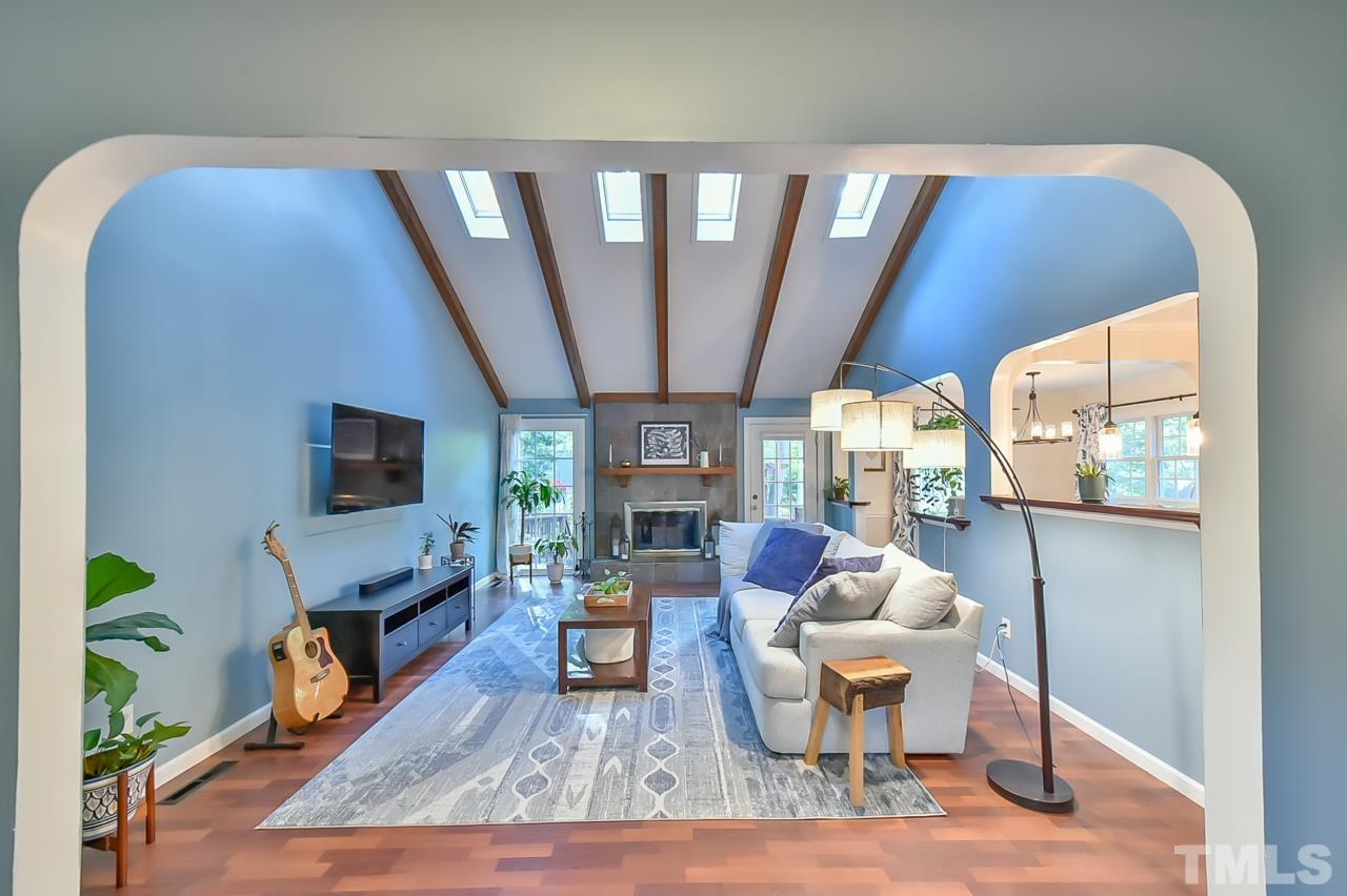 7204 Ray Road Raleigh, NC 27613 - Photo 17 of 40 a living room with furniture and a flat screen tv