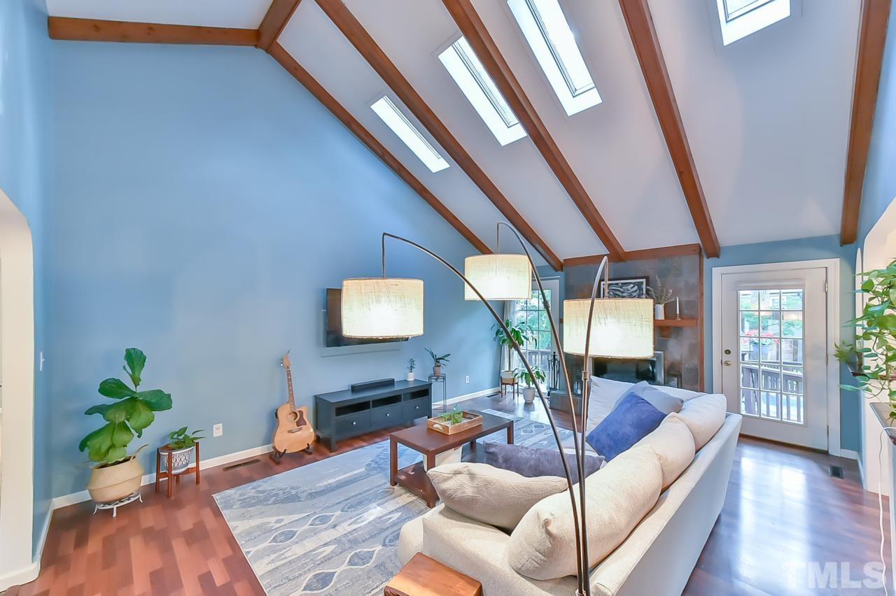 7204 Ray Road Raleigh, NC 27613 - Photo 18 of 40 a living room with furniture and a flat screen tv