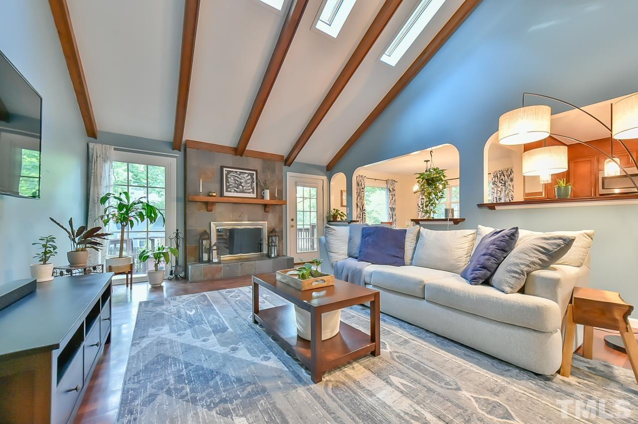 7204 Ray Road Raleigh, NC 27613 - Photo 19 of 40 a living room with fireplace furniture and a large window