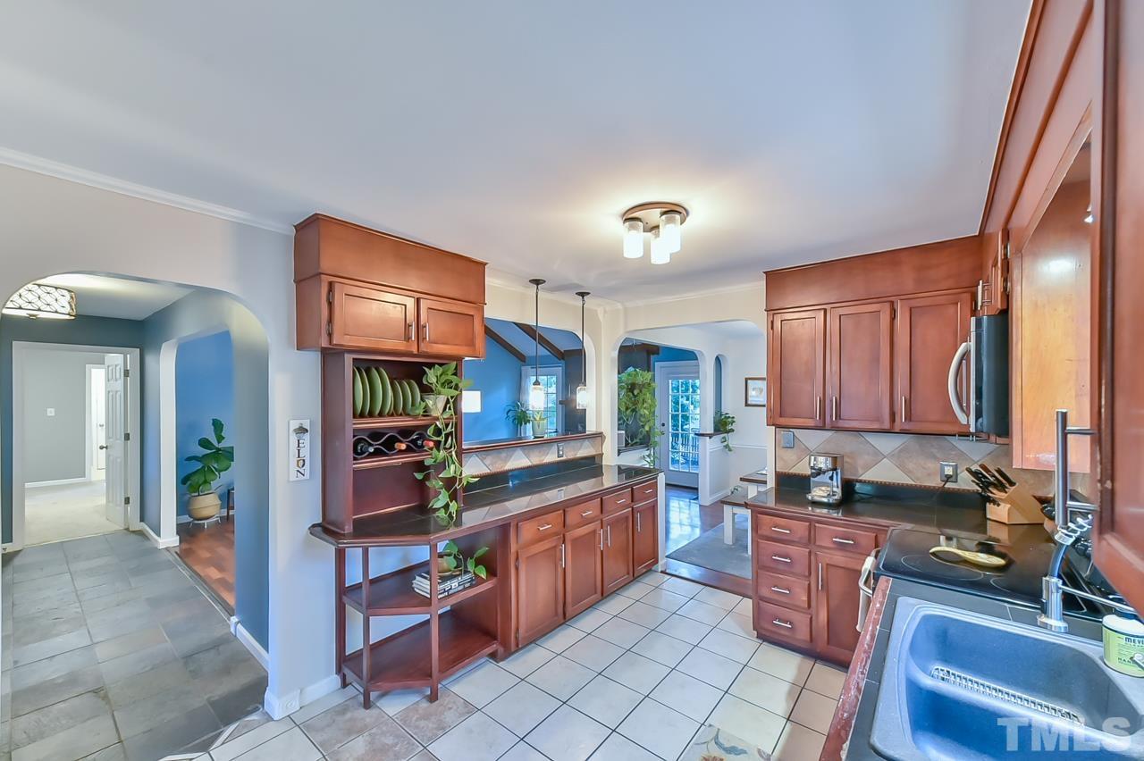 7204 Ray Road Raleigh, NC 27613 - Photo 27 of 40 a kitchen with lots of counter top space