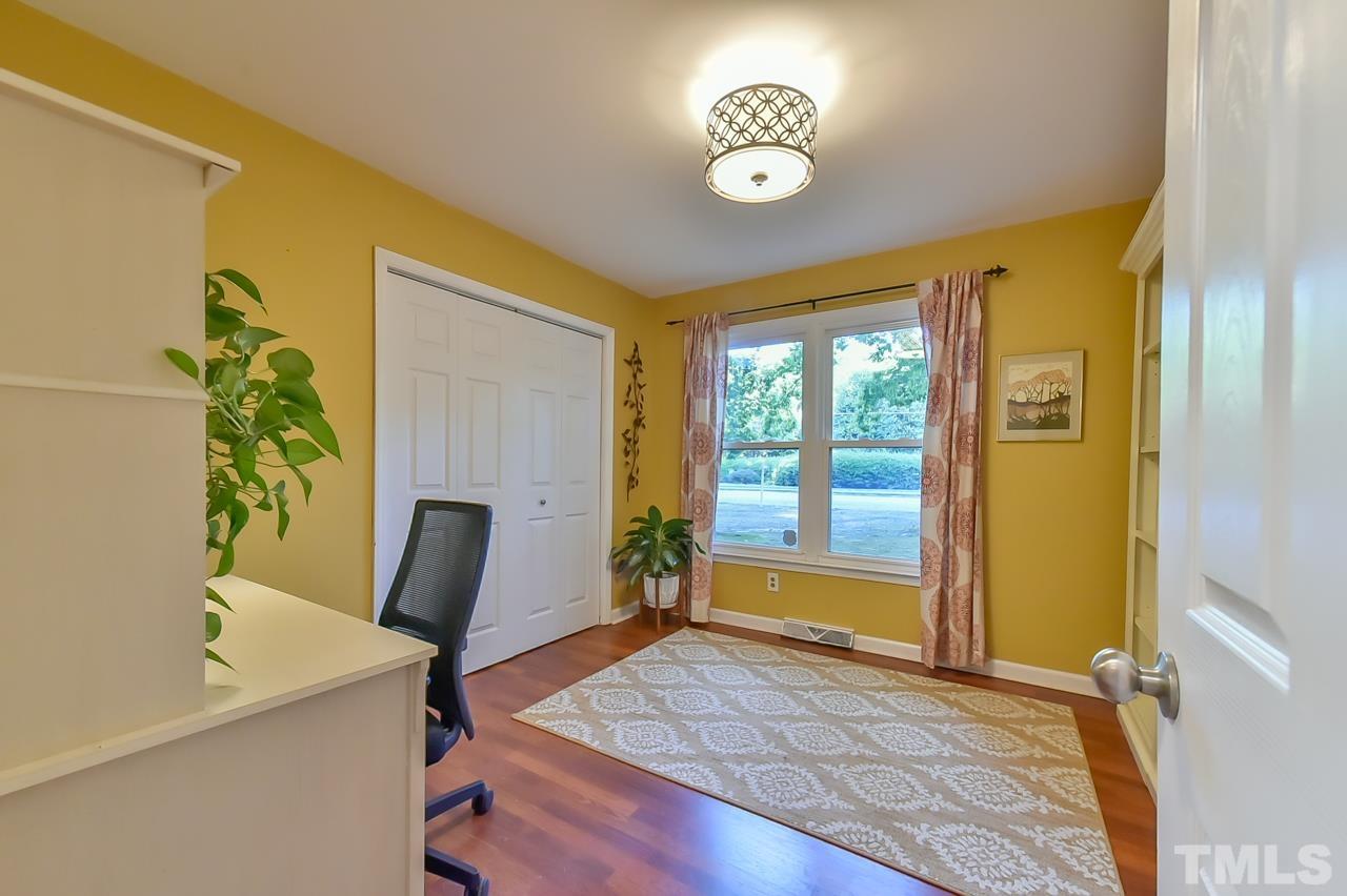 7204 Ray Road Raleigh, NC 27613 - Photo 29 of 40 a view of a workspace with furniture and a window