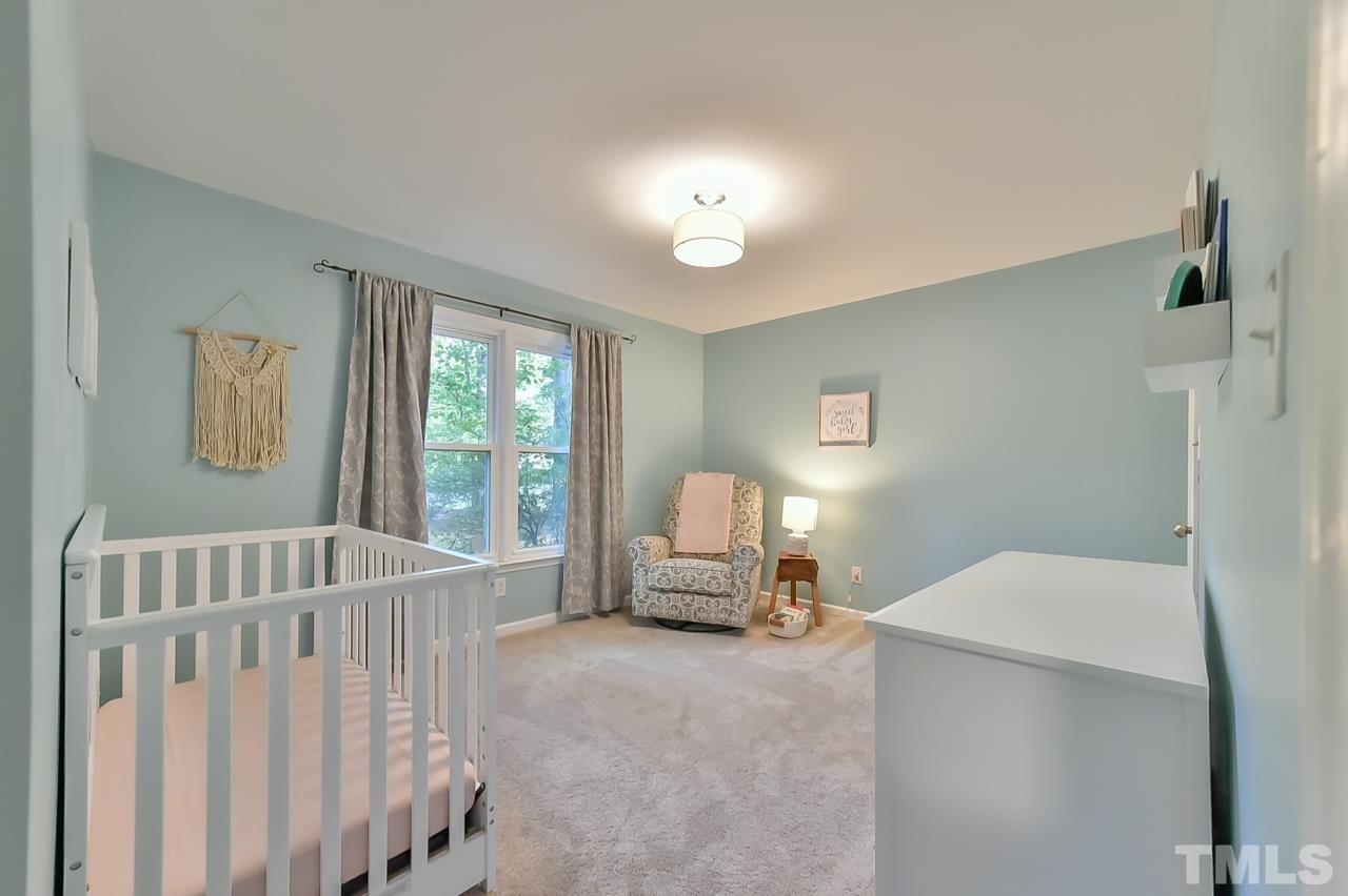 7204 Ray Road Raleigh, NC 27613 - Photo 31 of 40 a bedroom with furniture and windows