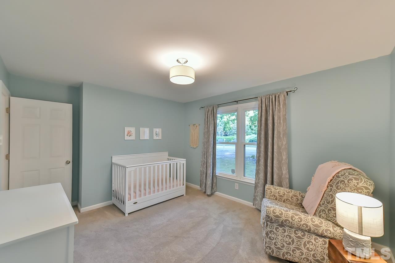 7204 Ray Road Raleigh, NC 27613 - Photo 33 of 40 a living room with furniture and a window