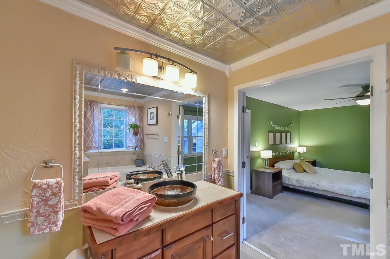 7204 Ray Road Raleigh, NC 27613 - Photo 39 of 40 a bedroom with furniture and a window