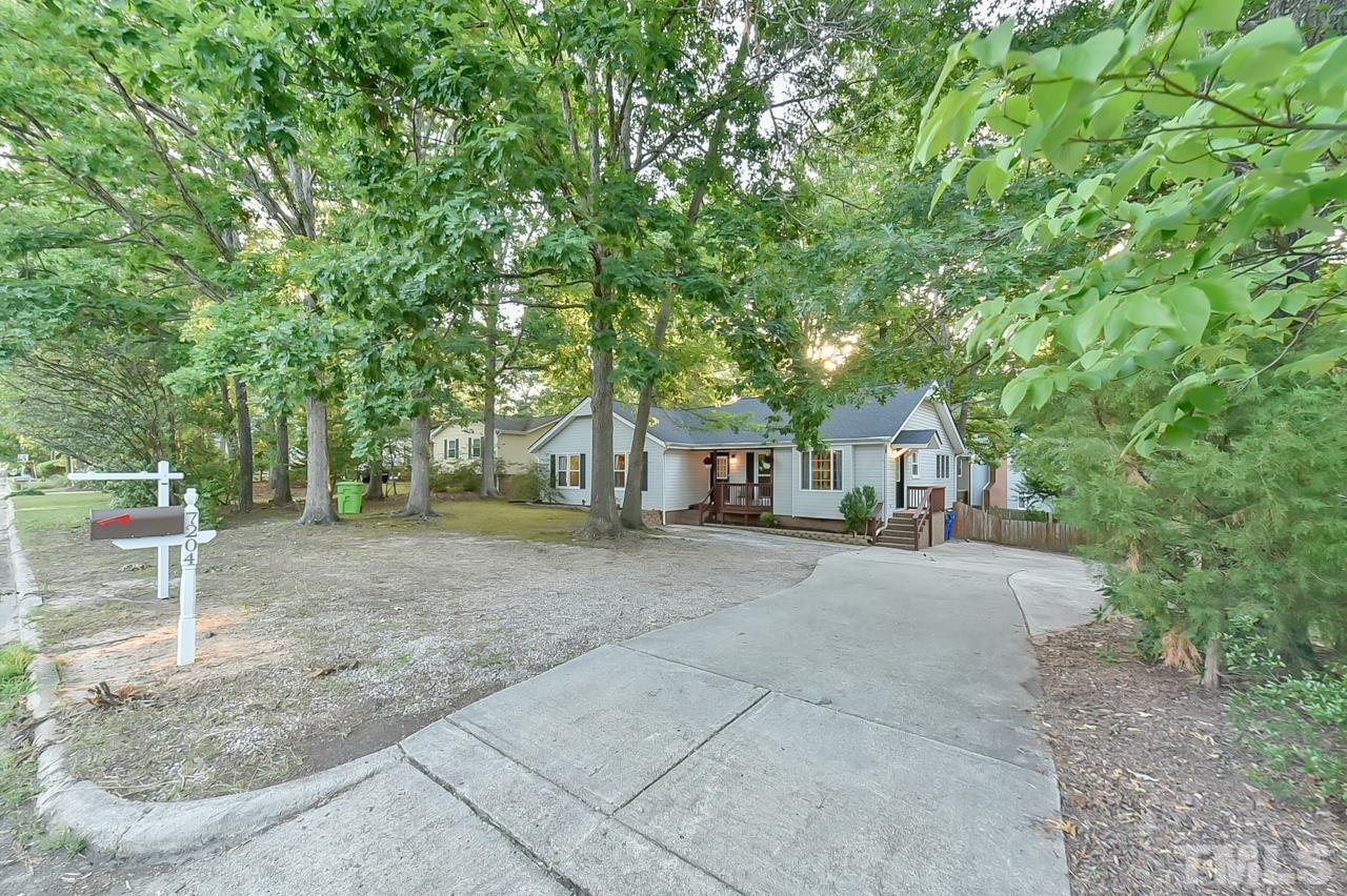 7204 Ray Road Raleigh, NC 27613 - Photo 40 of 40 a front view of a house with a yard and trees