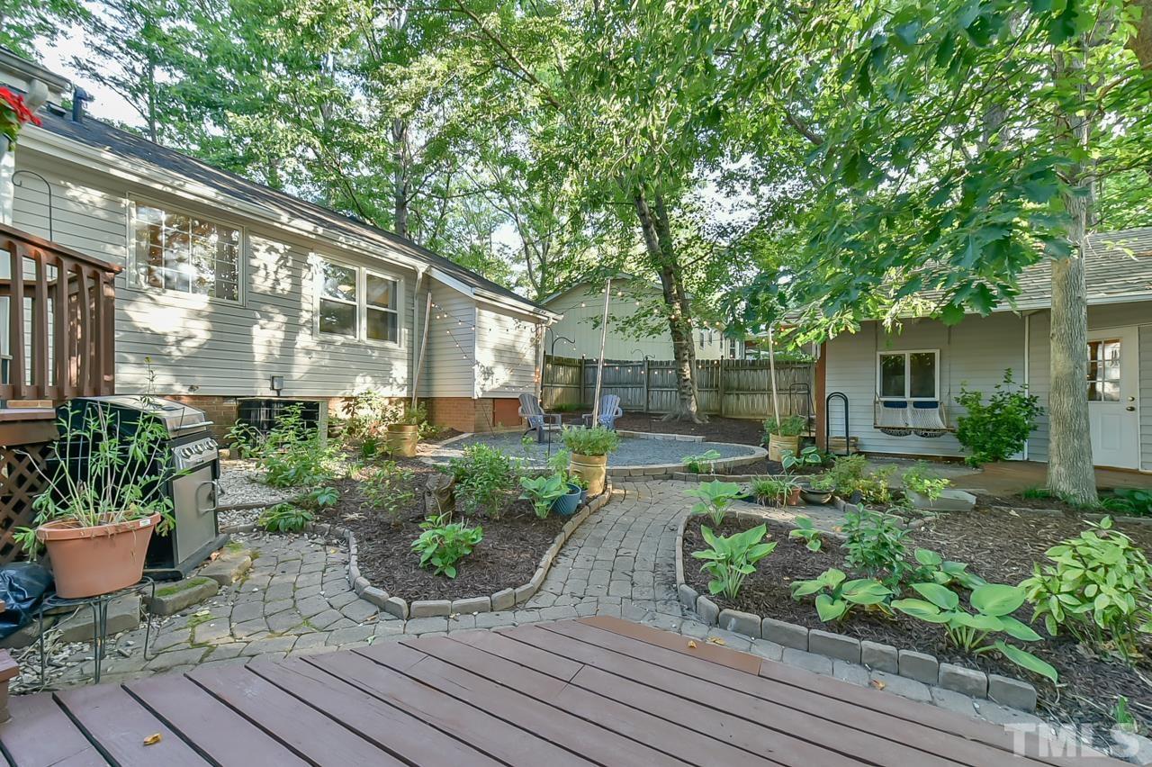 7204 Ray Road Raleigh, NC 27613 - Photo 4 of 40 a front view of a house with garden