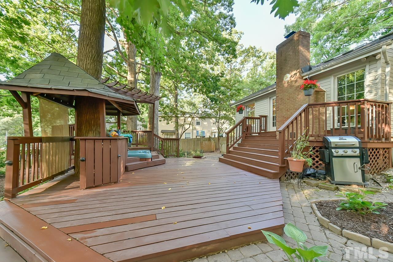 7204 Ray Road Raleigh, NC 27613 - Photo 6 of 40 a view of a deck with two couches next to a yard